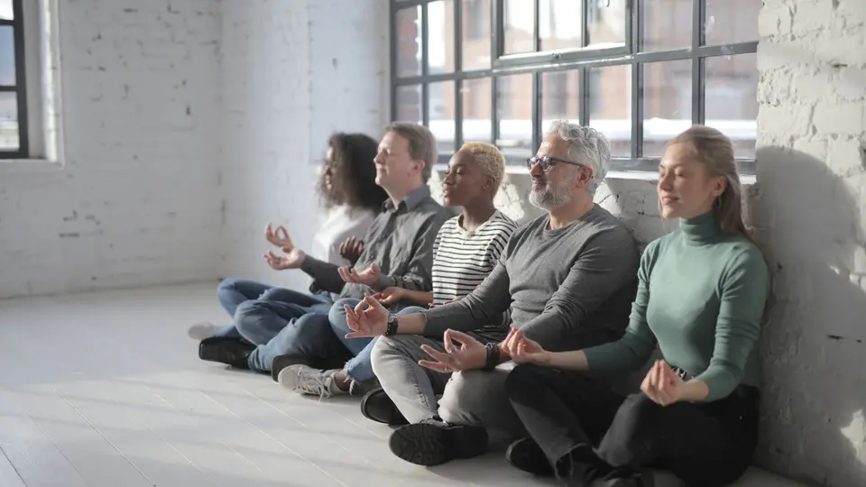 Startup executive team gathered in morning executive meditation session before sprint