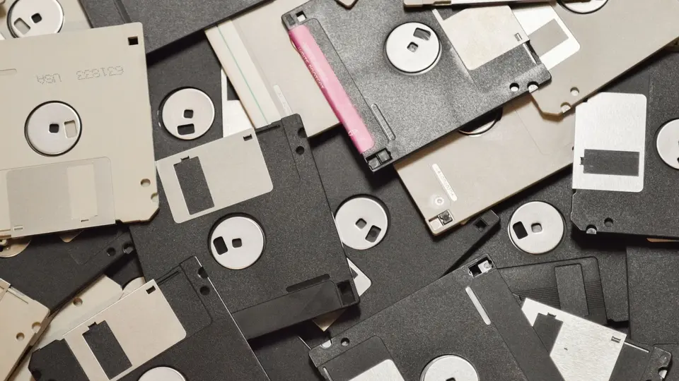 Mysterious glowing USB drive plugged into laptop in dimly lit room