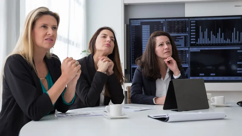 Young professional excelling during competitive corporate boardroom presentation